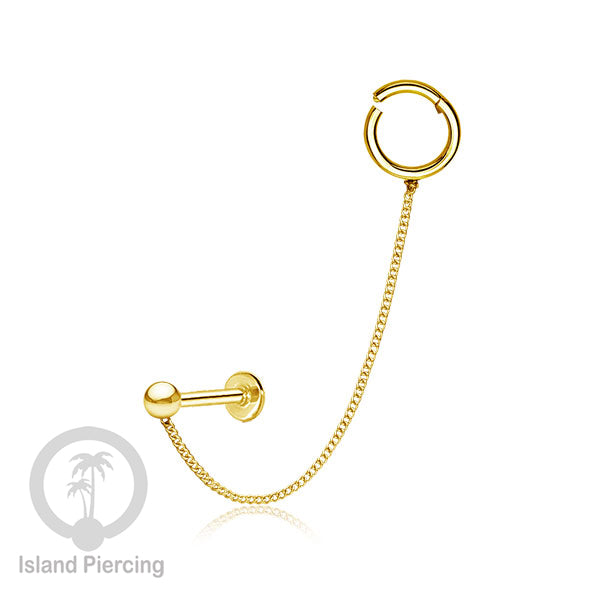 Piercing Set warna gold dengan Labret dan Hinged Segment Ring di sambung dengan Rantai.