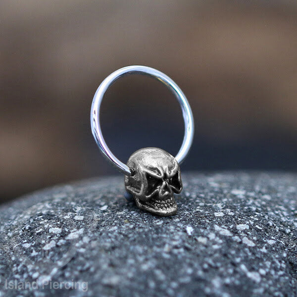 Piercing Stainless BCR dengan Liontin kuningan putih motif yang unik seperti Tengkorak, Ganesha