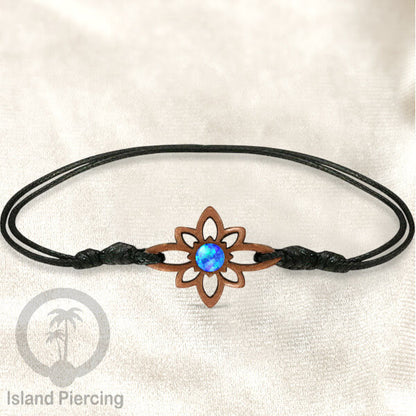 Gelang Tangan Tali yang pakai Liotin kayu Sawo dengan isi batu atau kerang asli
