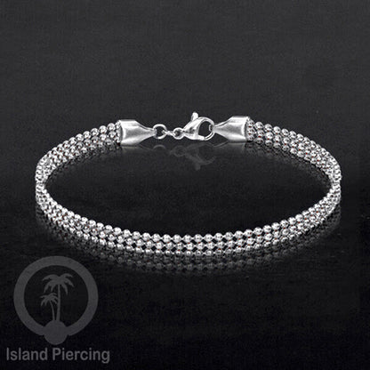 Gelang Tangan dari baja stainless warna silver. Model lebar 3-5 rantai.