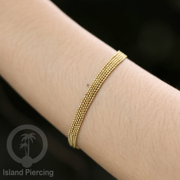 Gelang Tangan dari baja stainless warna emas. Model lebar 3-7 rantai.