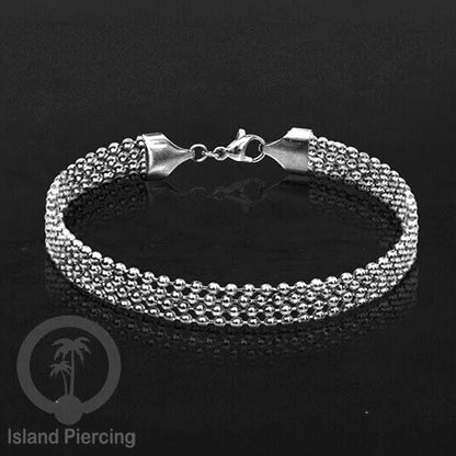 Gelang Tangan dari baja stainless warna silver. Model lebar 3-5 rantai.