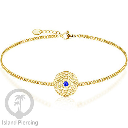 Gelang tribal lotus dari stainless steel dengan berbagai desain dan batu epoksi berwarna. Warna gold.