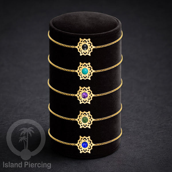 Gelang mandala dari stainless steel dengan berbagai desain dan batu epoksi berwarna. Warna gold.