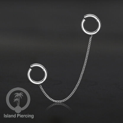 Piercing Set warna silver dengan dua Hinged Segment Ring sambung dengan Rantai.