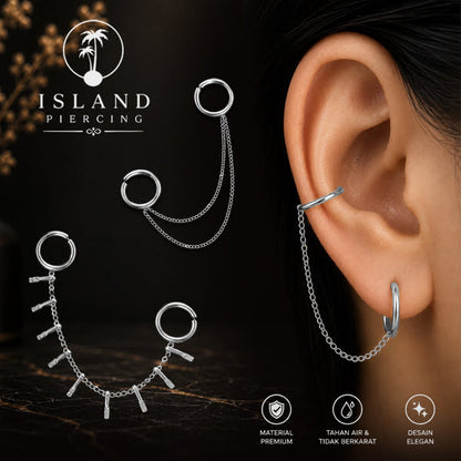 Piercing Set warna silver dengan dua Hinged Segment Ring disambung dengan Rantai.