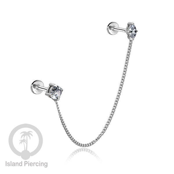 Piercing Set warna silver dengan dua Labret Kristal sambung dengan Rantai.