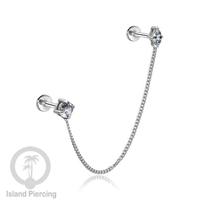 Piercing Set warna silver dengan dua Labret Kristal sambung dengan Rantai.
