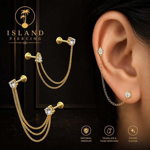 Piercing Set warna gold dengan dua Labret Kristal sambung dengan Rantai.