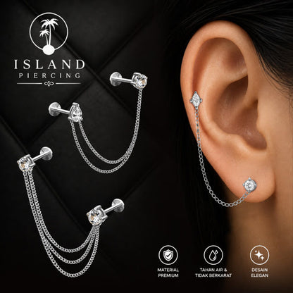 Piercing Set warna silver dengan dua Labret Kristal sambung dengan Rantai.