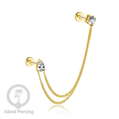Piercing Set warna gold dengan dua Labret Kristal sambung dengan Rantai.