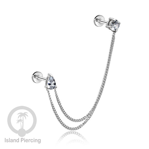 Piercing Set warna silver dengan dua Labret Kristal sambung dengan Rantai.