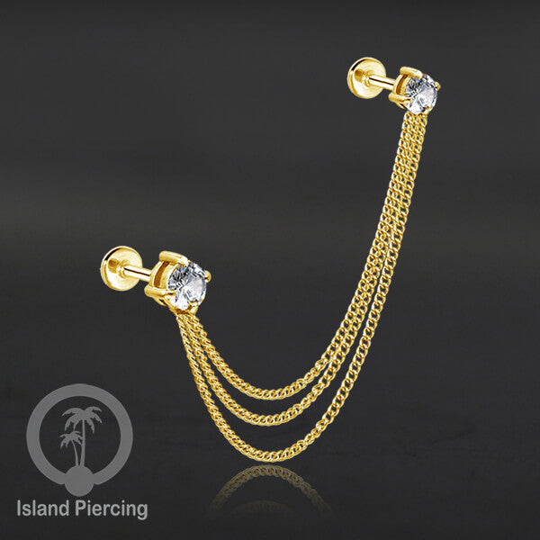 Piercing Set warna gold dengan dua Labret Kristal sambung dengan Rantai.