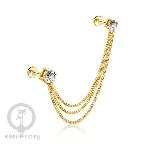 Piercing Set warna gold dengan dua Labret Kristal sambung dengan Rantai.