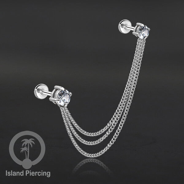 Piercing Set warna silver dengan dua Labret Kristal sambung dengan Rantai.