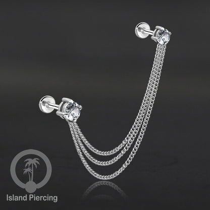 Piercing Set warna silver dengan dua Labret Kristal sambung dengan Rantai.