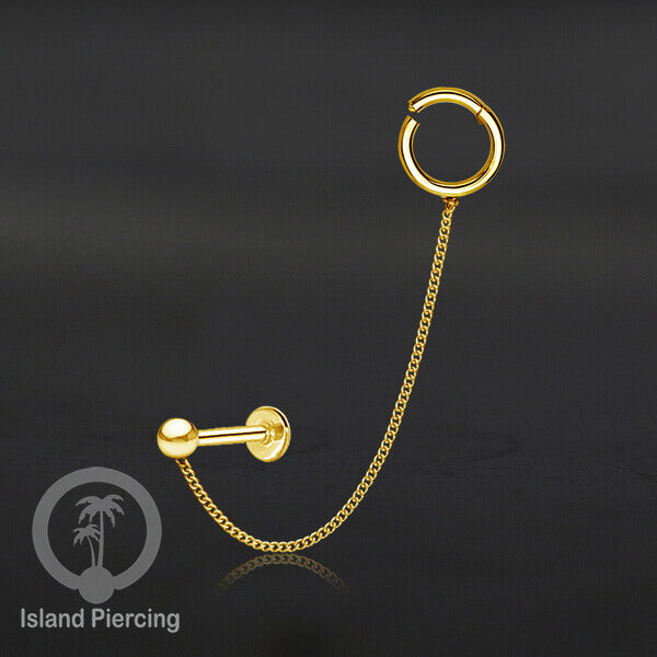Piercing Set warna gold dengan Labret dan Hinged Segment Ring di sambung dengan Rantai.