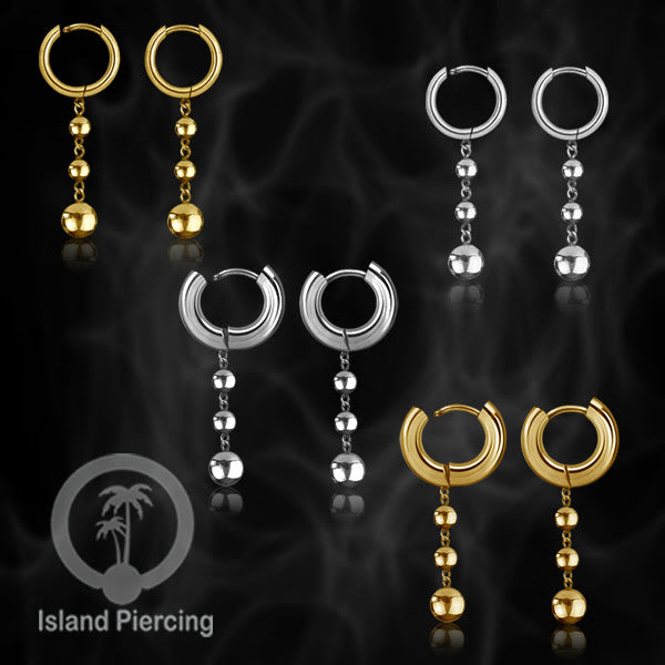 Anting hoop baja dengan liontin bola baja tersedia dalam warna silver atau gold.