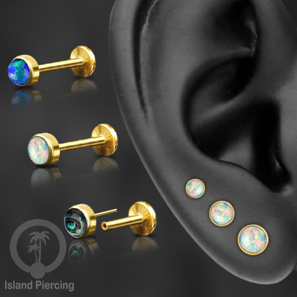 Tindik labret push system stainless, threadless piercing warna gold dengan abelone, opal putih dan biru.