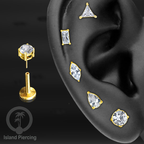 Piercing Labret Stainless Steel warna gold dengan Zirconia banyak bentuk.